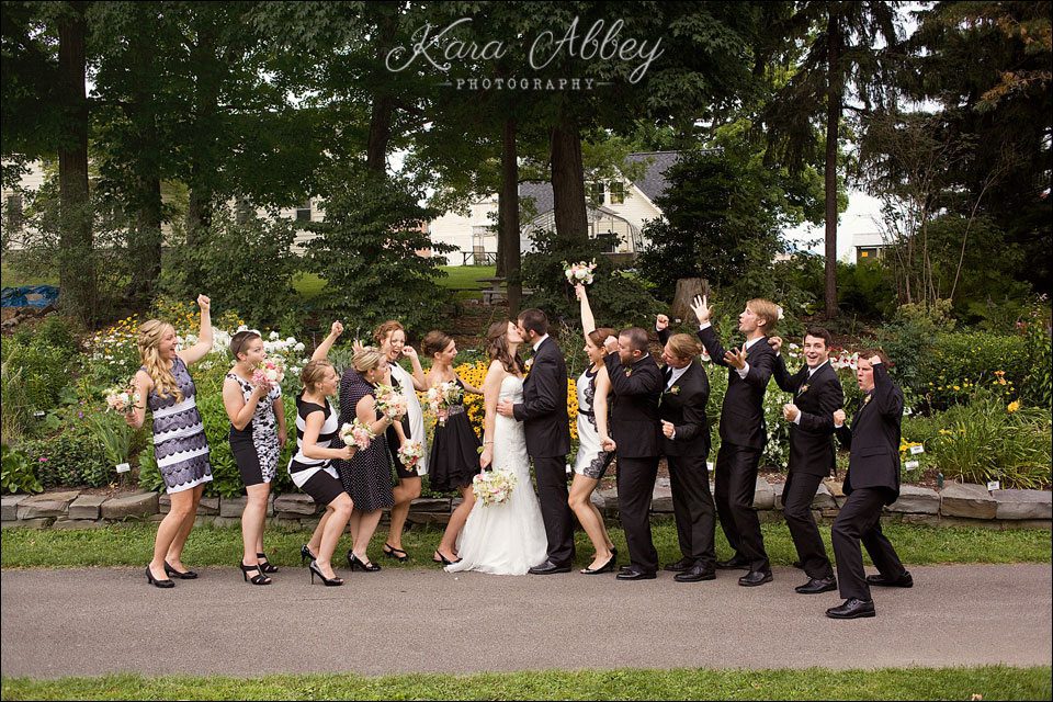 wedding day photography bridal party bride groom bridesmaids groomsmen cheering kissing gardens flowers binghamton ny