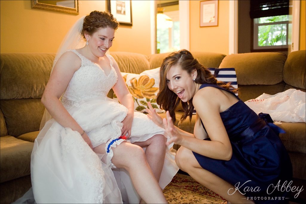 rainy day wedding photography Vestal NY bride getting ready garter