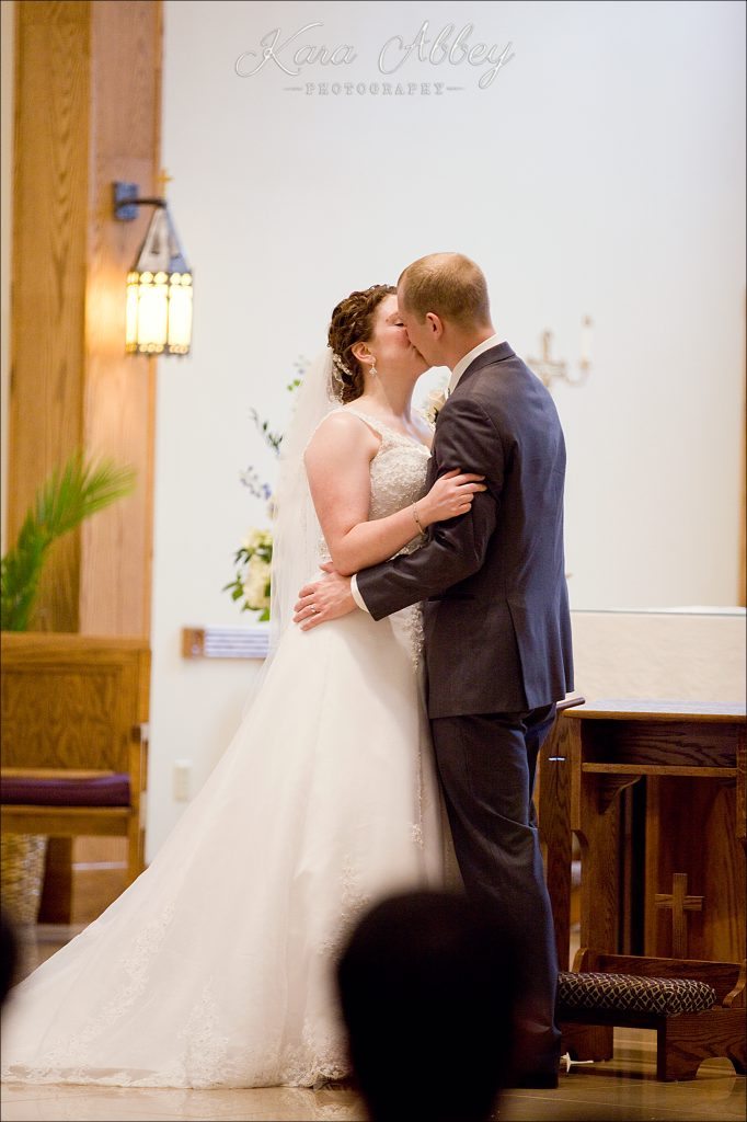 rainy day wedding photography Vestal NY Our Lady of Sorrows Ceremony first kiss