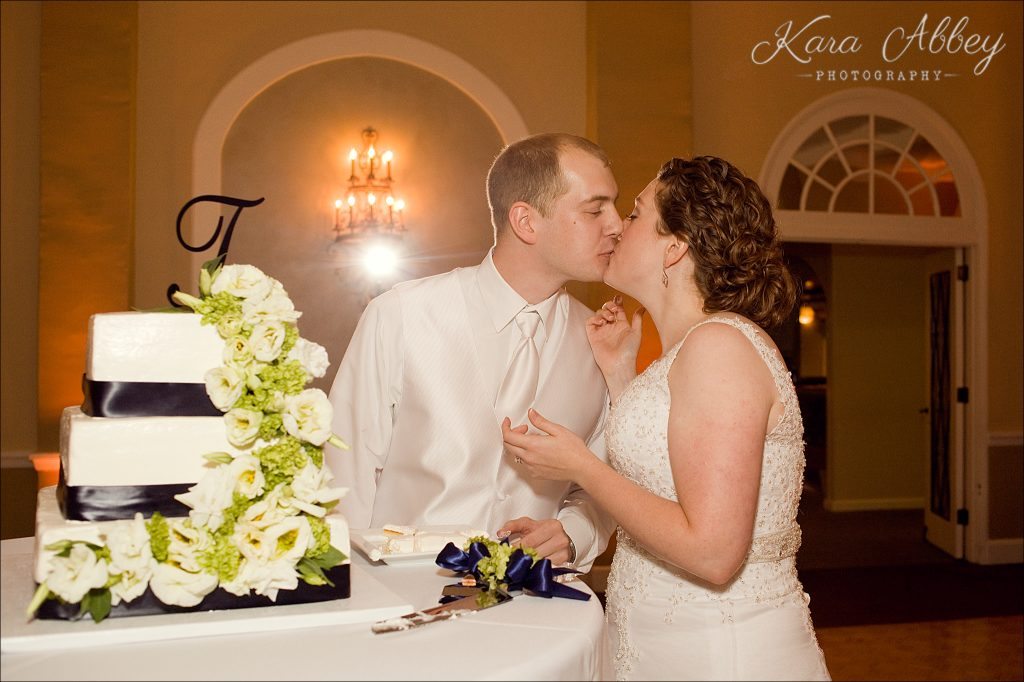 rainy day wedding photography Binghamton NY Binghamton Country Club reception cut the cake Baked Euphoria