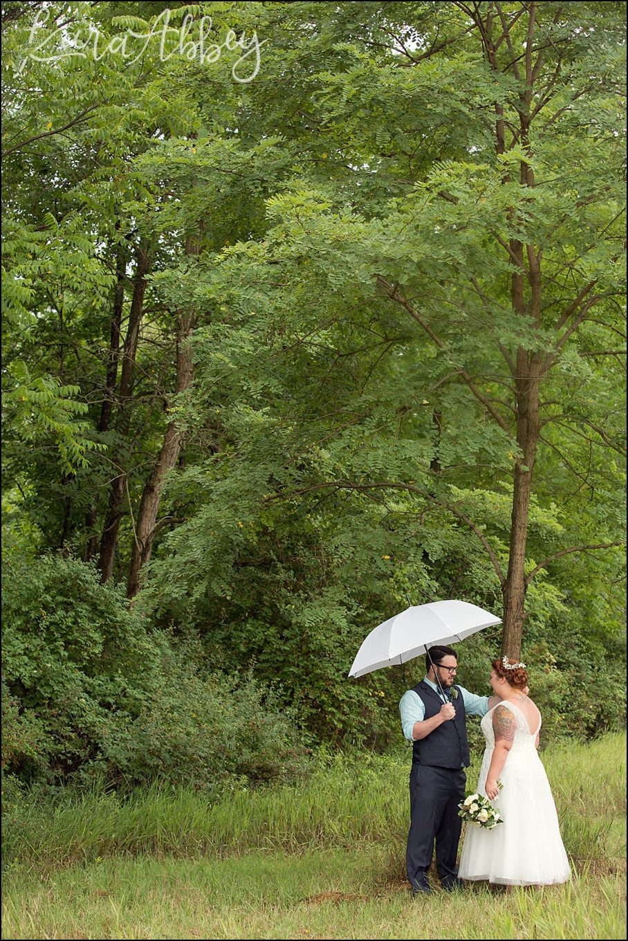 Rustic Pastel Rainy Summer Wedding First Look at Robert Treman State Park in Ithaca, NY by Kara Abbey Photography in Irwin, PA