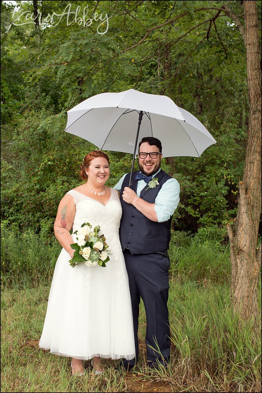 Rustic Pastel Rainy Summer Wedding First Look at Robert Treman State Park in Ithaca, NY by Kara Abbey Photography in Irwin, PA