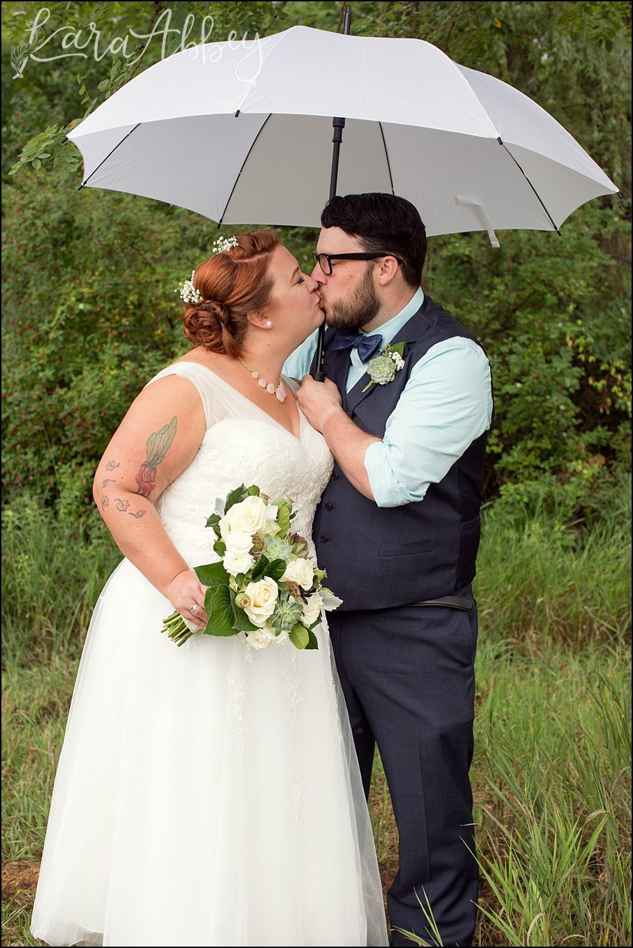 Rustic Pastel Rainy Summer Wedding First Look at Robert Treman State Park in Ithaca, NY by Kara Abbey Photography in Irwin, PA
