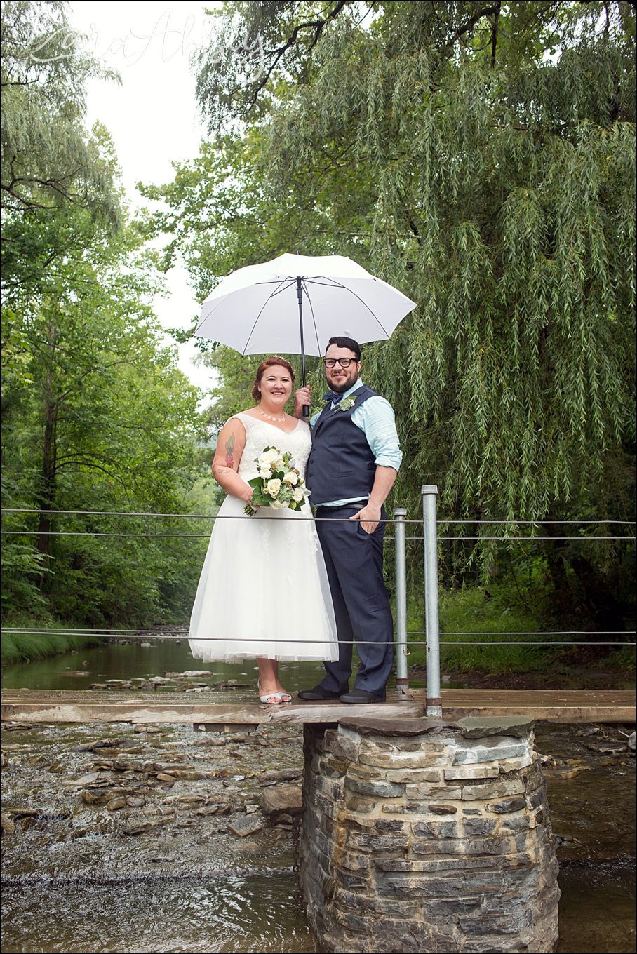 Rustic Pastel Rainy Summer Wedding First Look at Robert Treman State Park in Ithaca, NY by Kara Abbey Photography in Irwin, PA