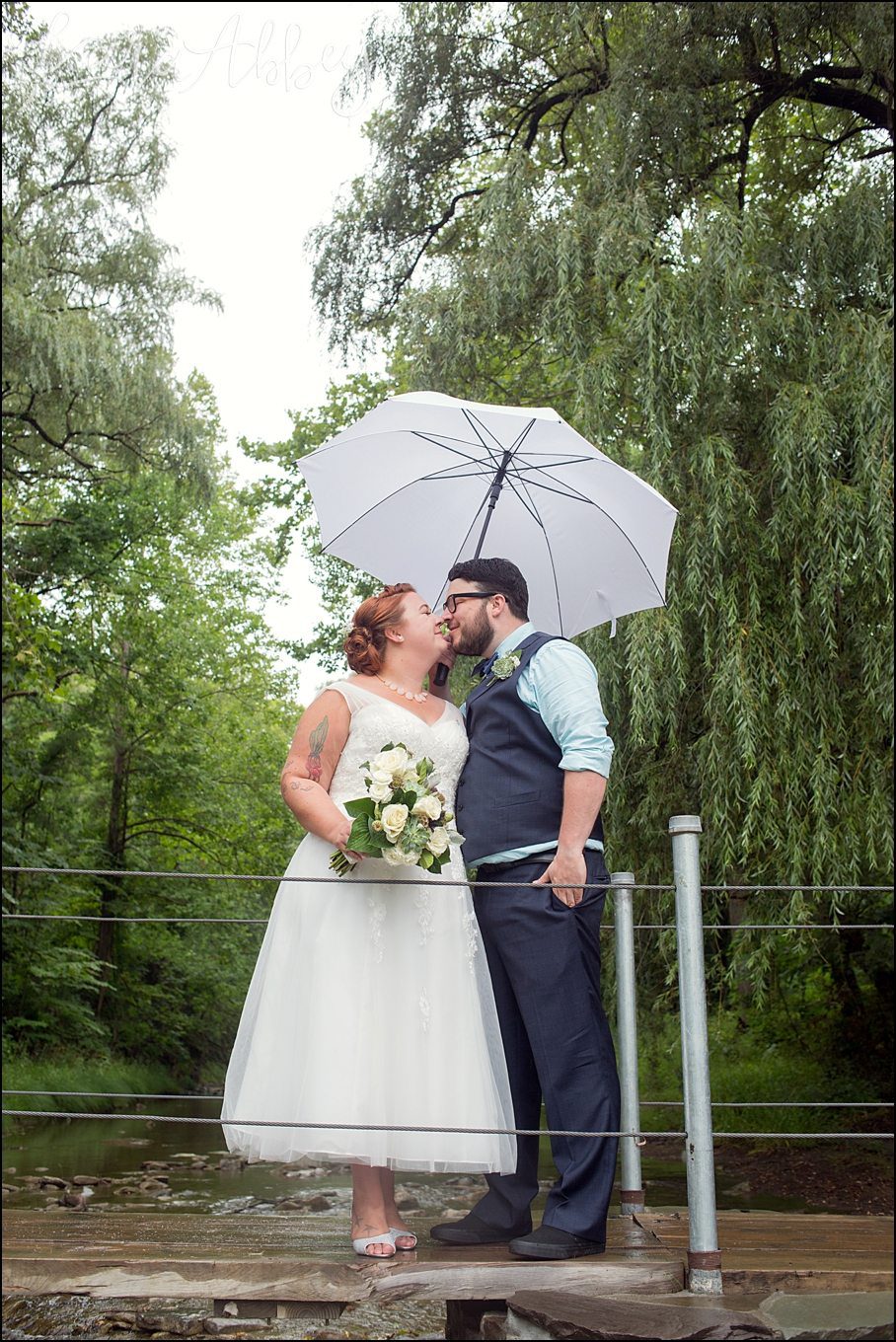 Rustic Pastel Rainy Summer Wedding First Look at Robert Treman State Park in Ithaca, NY by Kara Abbey Photography in Irwin, PA