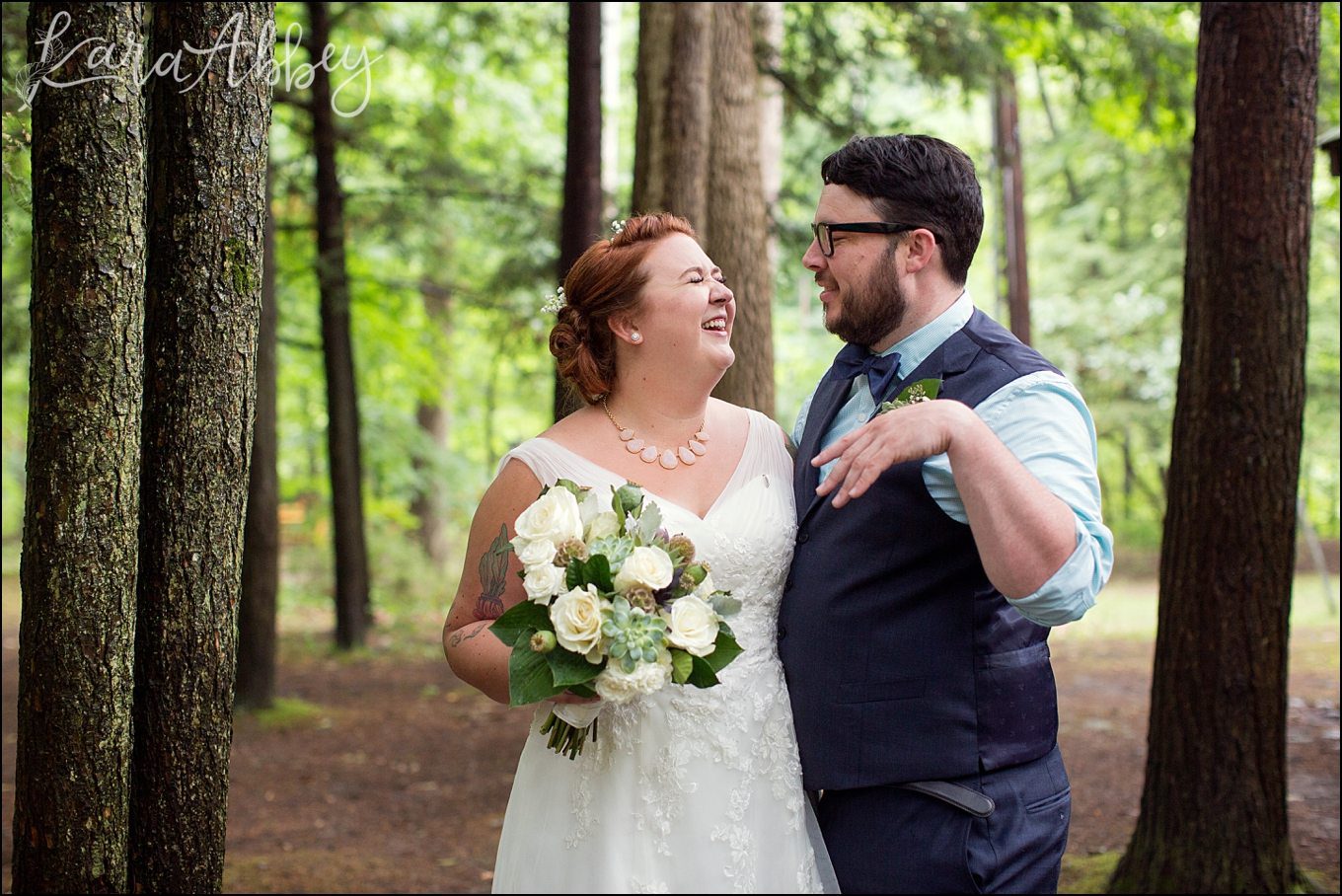 Rustic Pastel Rainy Summer Wedding First Look at Robert Treman State Park in Ithaca, NY by Kara Abbey Photography in Irwin, PA