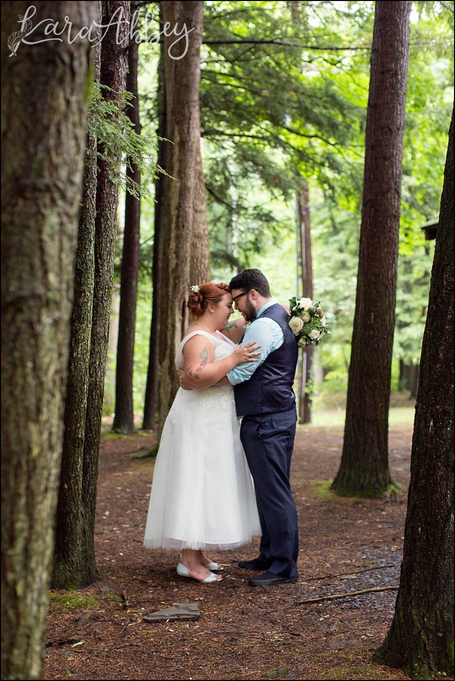 Rustic Pastel Rainy Summer Wedding First Look at Robert Treman State Park in Ithaca, NY by Kara Abbey Photography in Irwin, PA