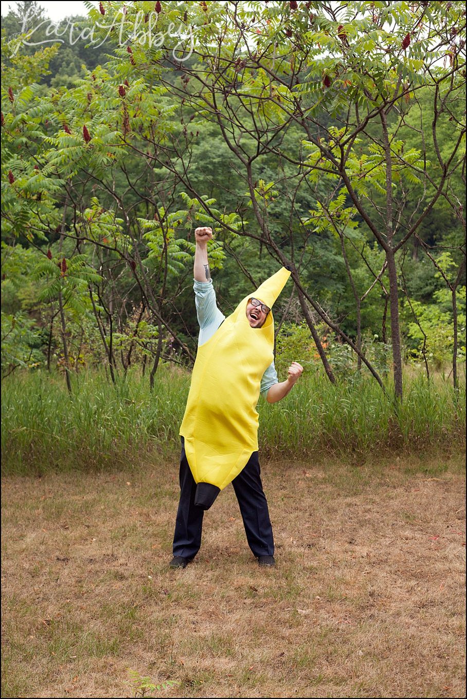 Rustic Pastel Rainy Summer Wedding Groom in a Banana Costume at Robert Treman State Park in Ithaca, NY by Kara Abbey Photography in Irwin, PA