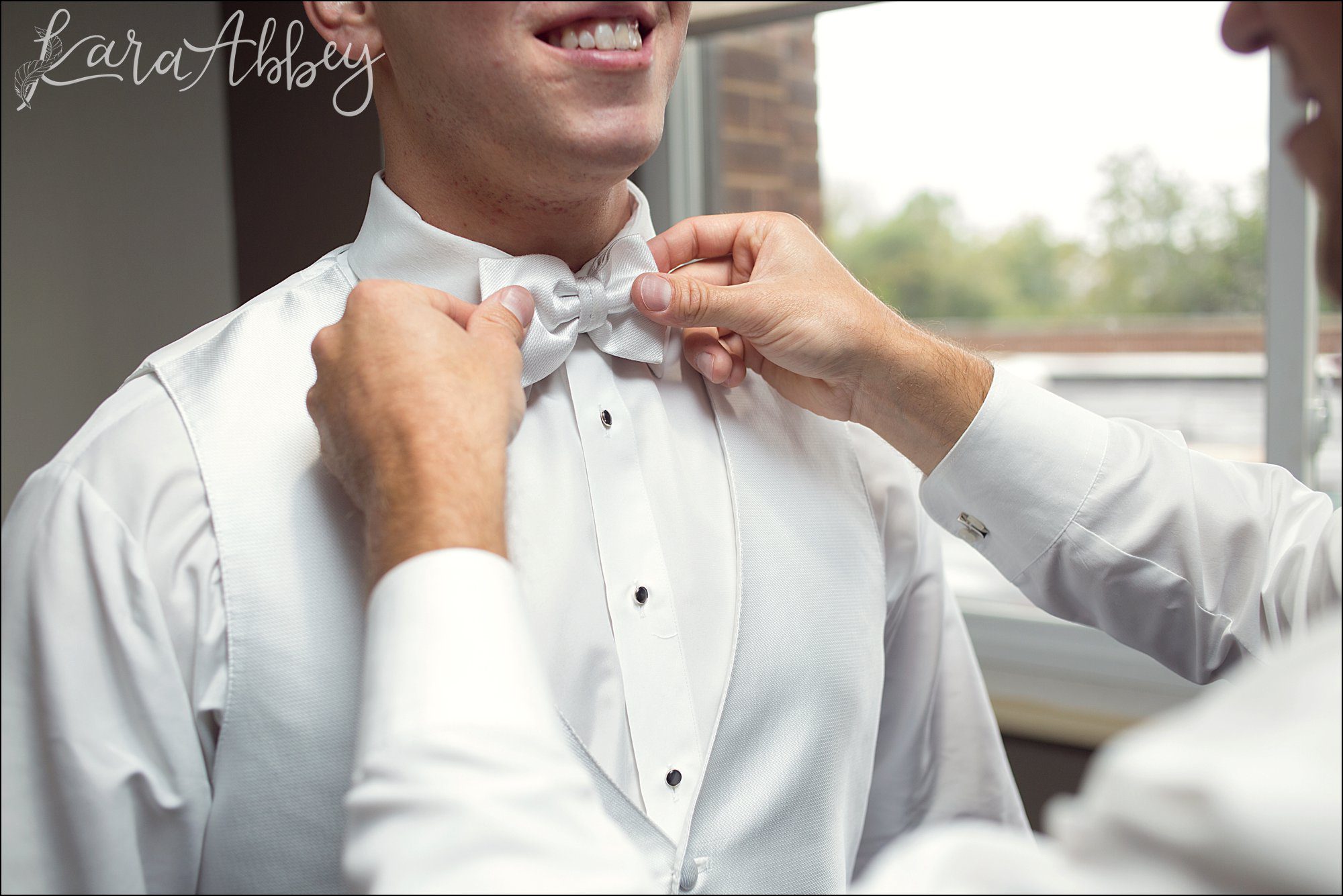 Groom Getting Ready for Wedding - White Bow Tie