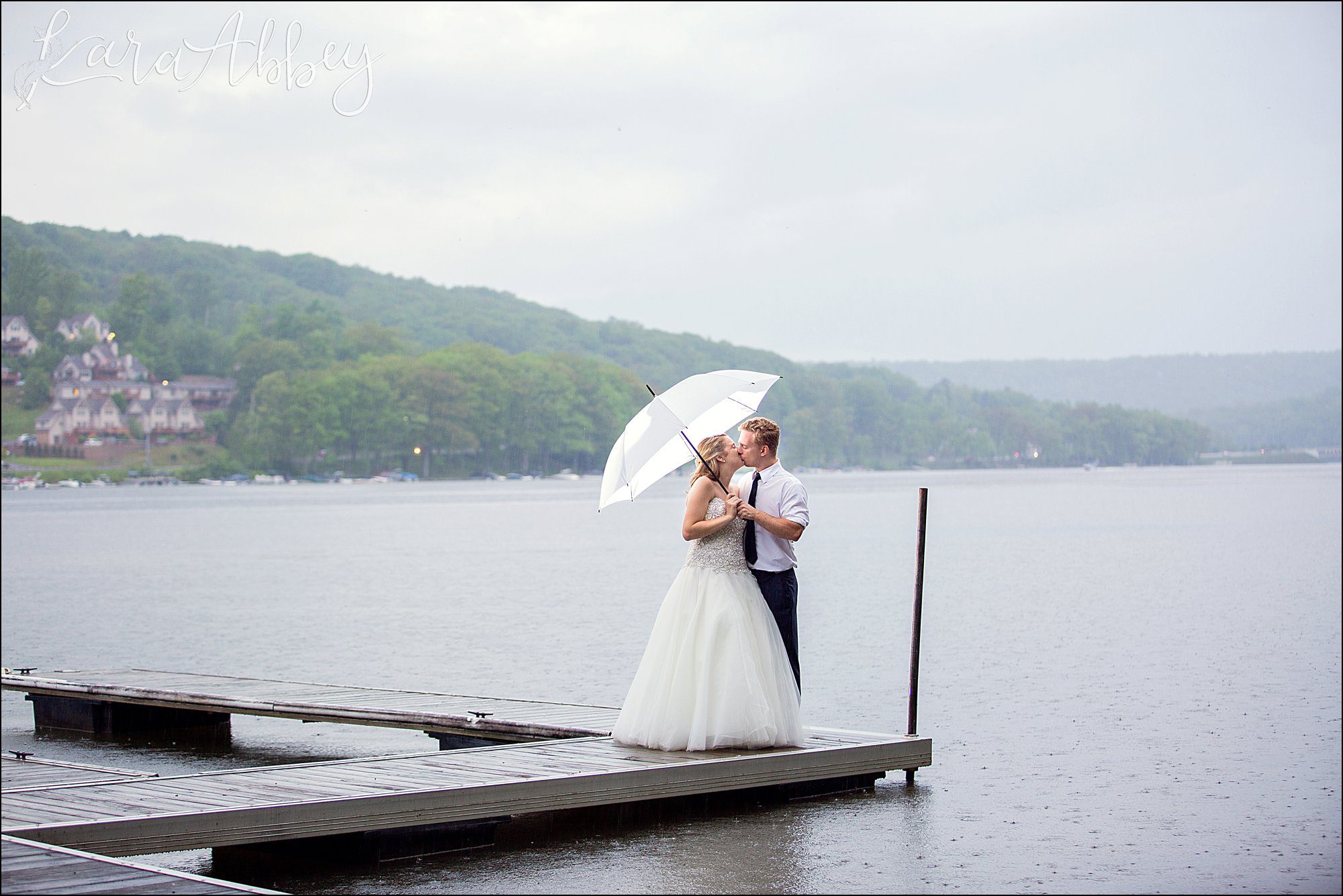 Bride & Groom Wedding Day Portrait in the Rain on the Dock at Deep Creek Lake, MD