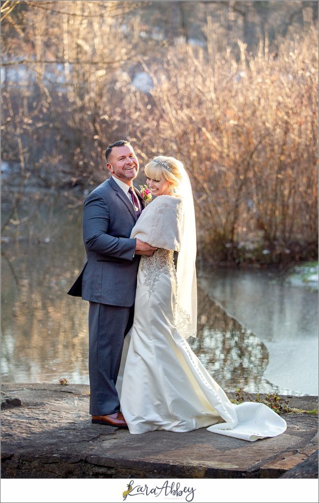 Purple & Grey Fall Wedding Pictures at Green Gables Jennerstown PA - Bride & Groom Newlywed Portraits at Golden Hour on the Dam with the Waterfall