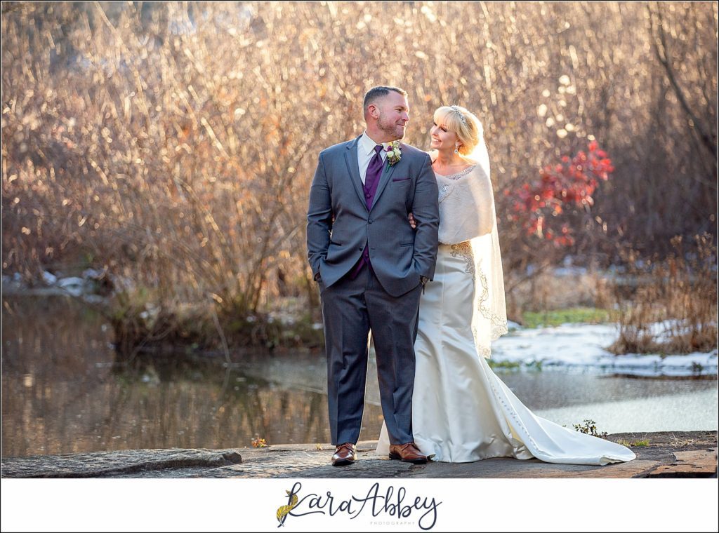 Purple & Grey Fall Wedding Pictures at Green Gables Jennerstown PA - Bride & Groom Newlywed Portraits at Golden Hour on the Dam with the Waterfall