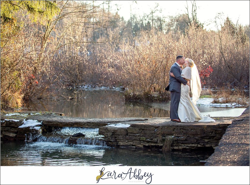 Purple & Grey Fall Wedding Pictures at Green Gables Jennerstown PA - Bride & Groom Newlywed Portraits at Golden Hour on the Dam with the Waterfall
