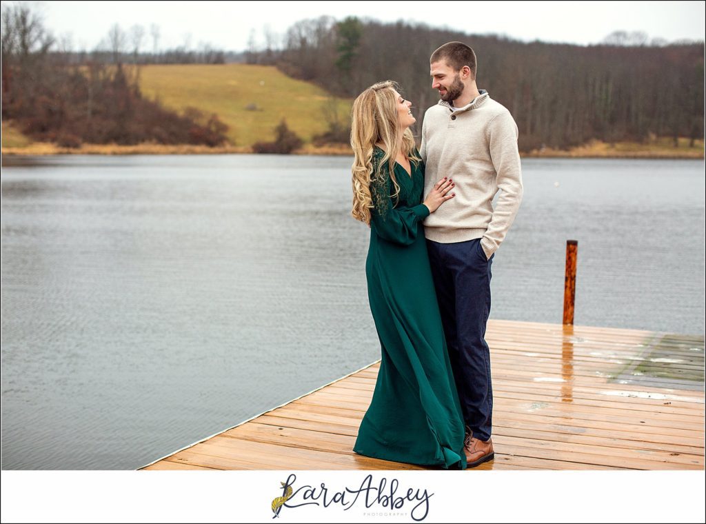 Cold Rainy Engagement Session on Family Property along a Lake in Pennsylvania by Kara Abbey Photography