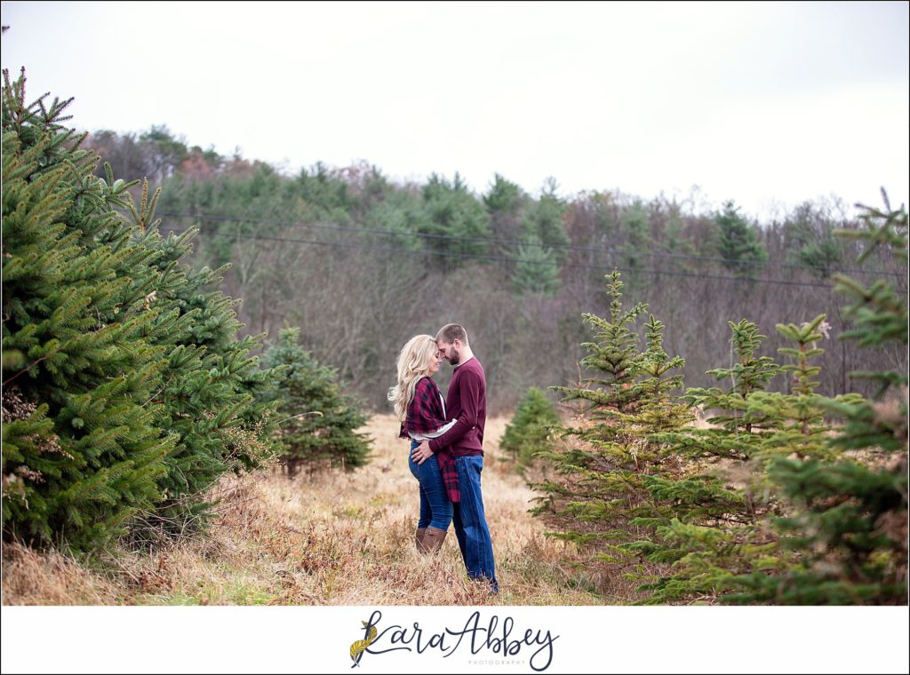 Cold Rainy Engagement Session on Family Christmas Tree Farm in Pennsylvania by Kara Abbey Photography