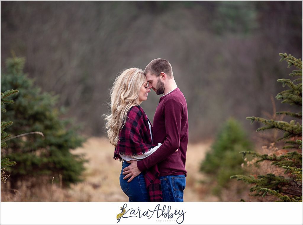 Cold Rainy Engagement Session on Family Christmas Tree Farm in Pennsylvania by Kara Abbey Photography
