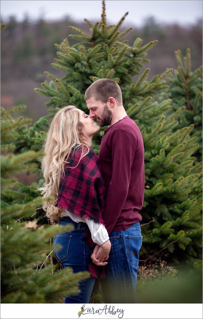 Cold Rainy Engagement Session on Family Christmas Tree Farm in Pennsylvania by Kara Abbey Photography