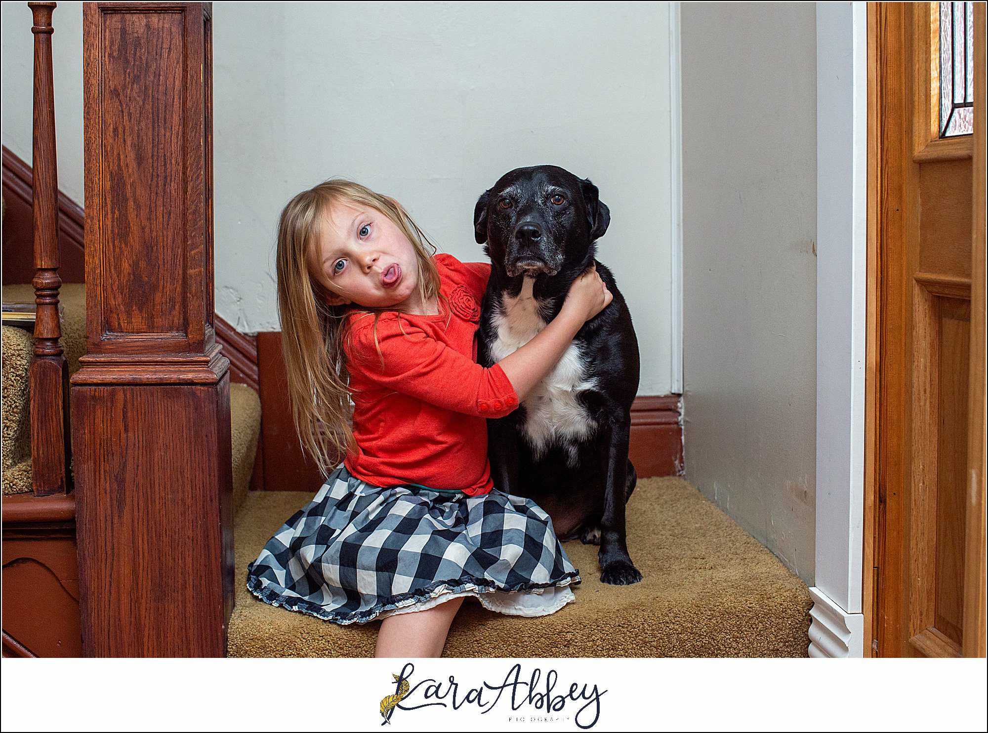 Black Lab and Little Girl with Silly Face