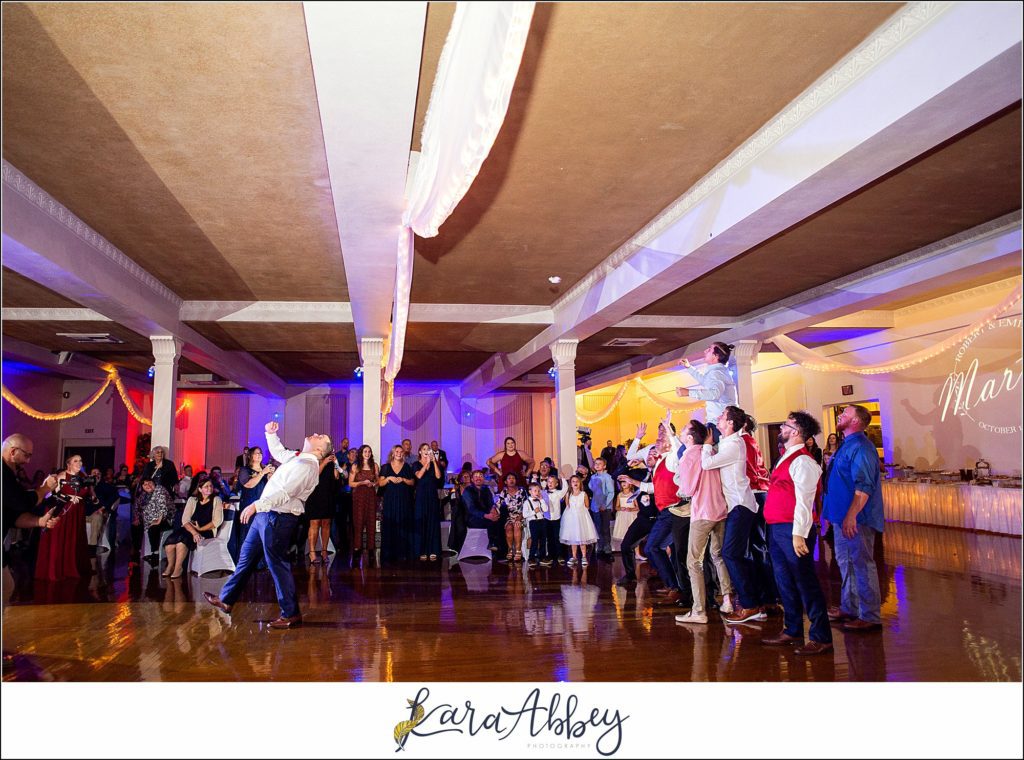 Burgundy & Navy Fall Wedding in Johnstown, PA - Reception at The Johnstown Masonic Temple Garter Toss