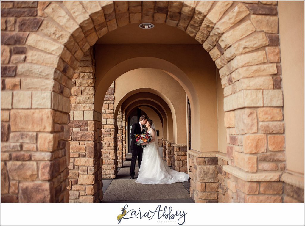 Elegant Purple Fall Wedding Reception at The Holy Trinity Center in Pittsburgh, PA - Bride & Groom Portraits Under the Arches