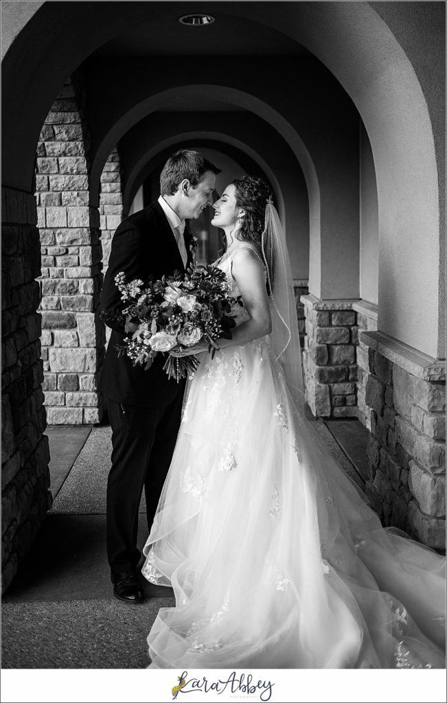 Elegant Purple Fall Wedding Reception at The Holy Trinity Center in Pittsburgh, PA - Bride & Groom Portraits Under the Arches