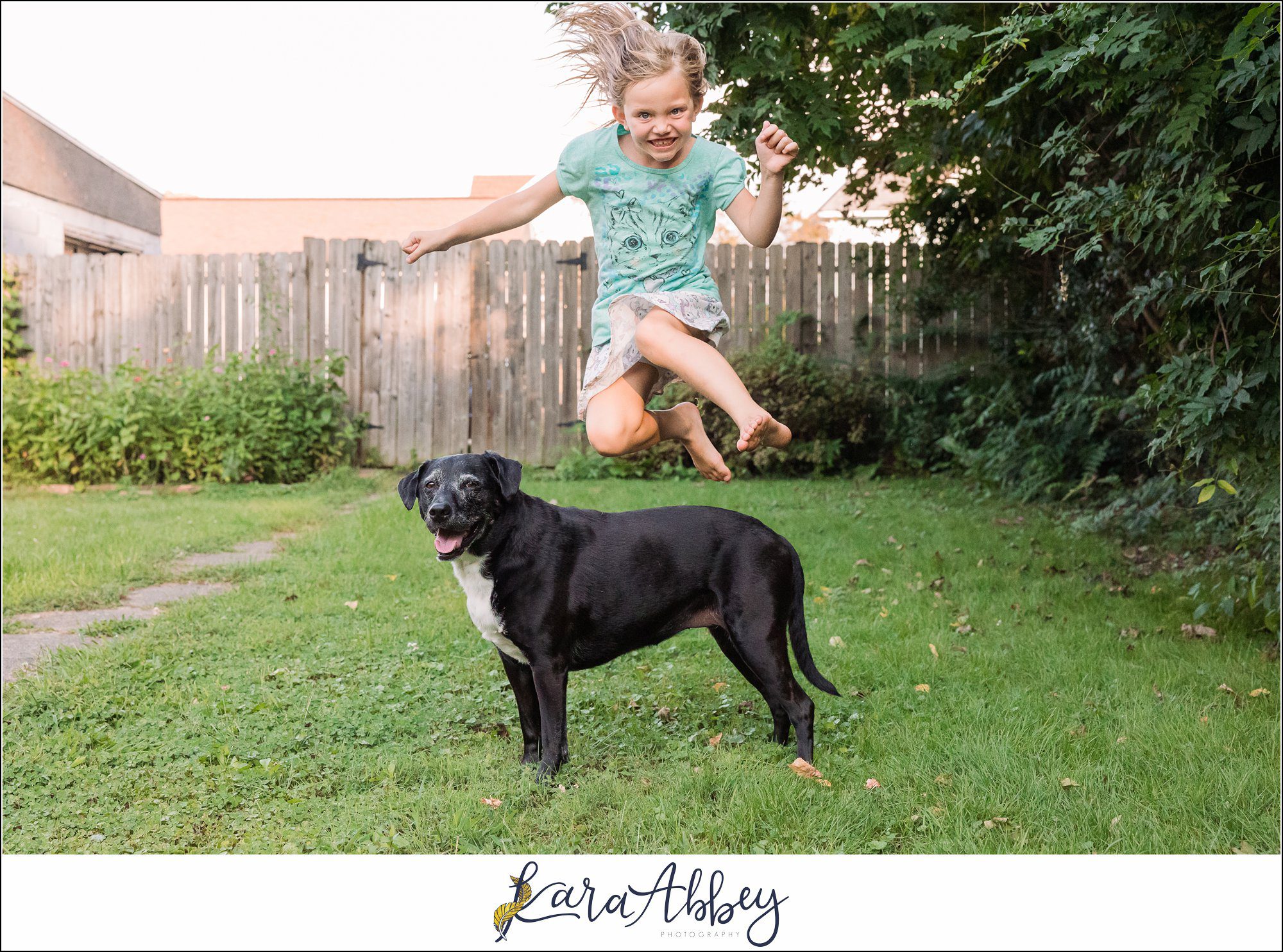 Abbys Saturday Little Girl Jumping Over Black Lab in Irwin PA