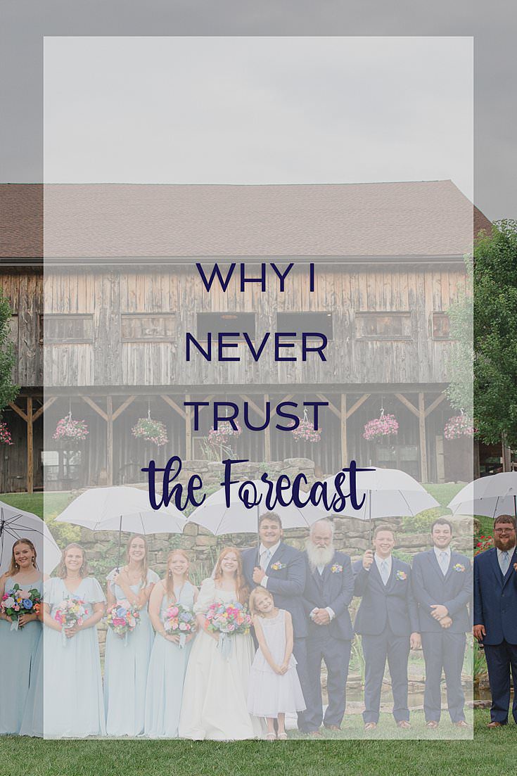 Bride and groom standing outside under an umbrella in the rain, with text overlay reading "Why I Never Trust The Forecast"